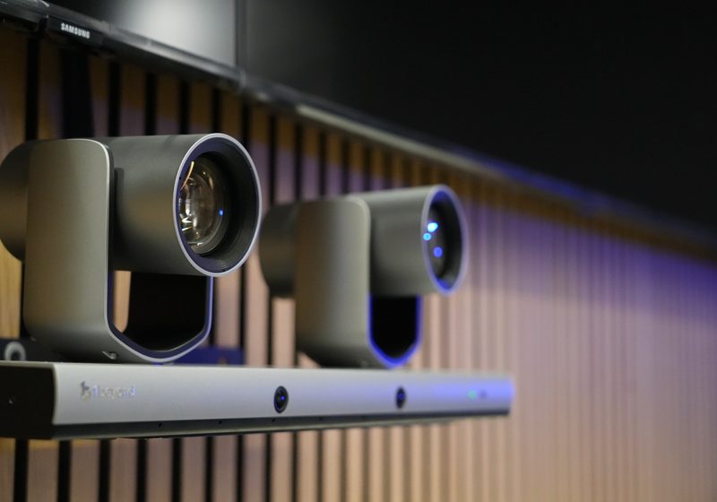 Close-up of boardroom camera bar installed below a display.