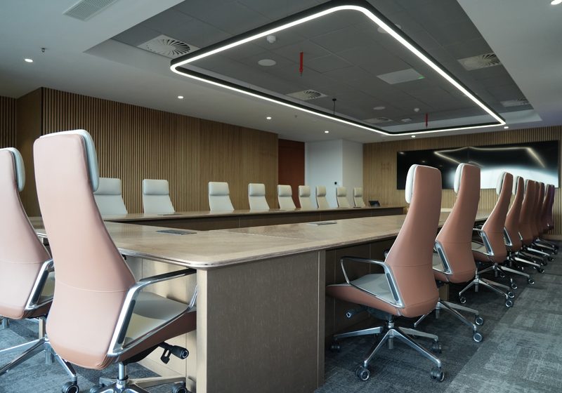 Premium executive boardroom with integrated display and collaboration technology.