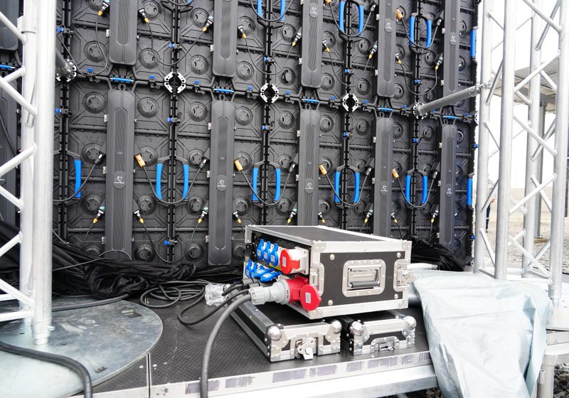 Rear view of LED wall with power distribution and truss support.